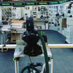 Electric bike on display in a showroom with accessories.