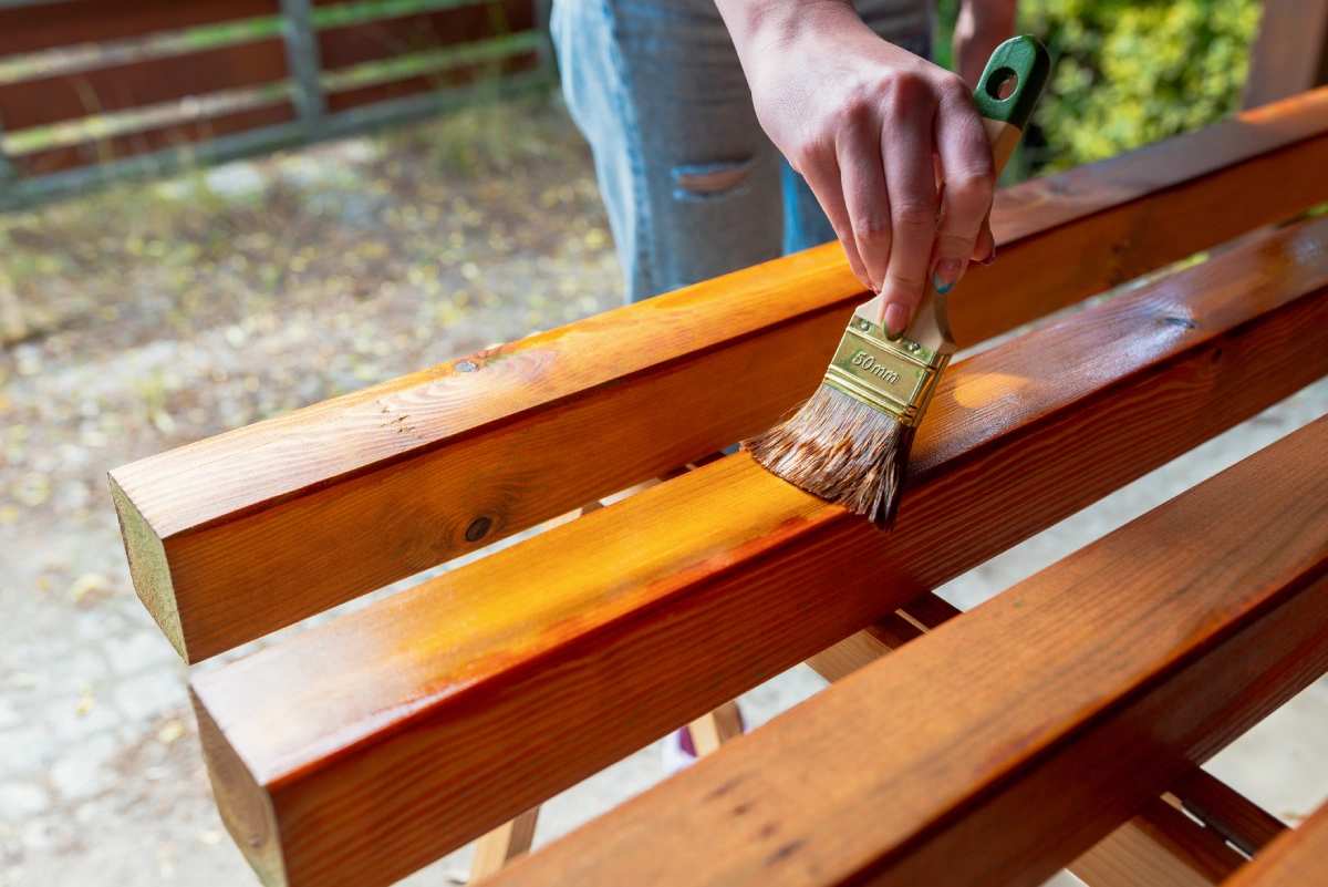 Staining wooden beams outdoors
