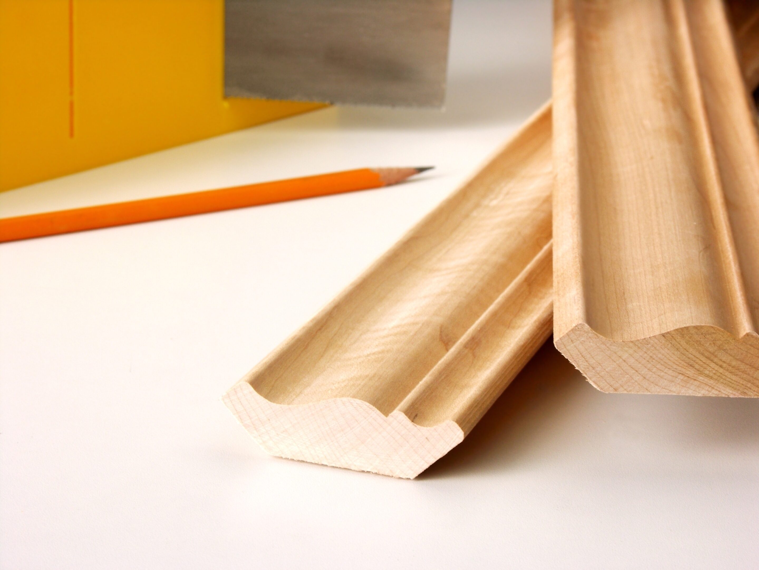 Carpentry tools and wooden trim pieces